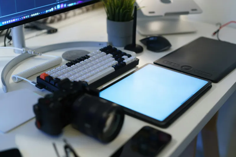 A minimal editorial workspace — an open notebook on a clean desk, the visual register Neural Tech Daily aims for